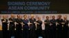 ASEAN leaders from left, Philippine President Benigno Aquino III, Singapore's Prime Minister Lee Hsien Loong, Thai Prime Minister Prayuth Chan-ocha, Vietnam's Prime Minister Nguyen Tan Dung, Malaysia's Prime Minister Najib Razak, Laos' Prime Minister Thongsing Thammavong, Brunei's Sultan Hassanal Bolkiah, Cambodia's Prime Minister Hun Sen, Indonesia's Prime Minister Joko Widodo and Myanmar's President Thein Sein join their hands as they pose for photographers after the signing ceremony of the 2015 Kuala Lumpur Declaration on the Establishment of the Association of Southeast Asian Nations (ASEAN) Community and the Kuala Lumpur Declaration on ASEAN 2025, in Kuala Lumpur, Malaysia, Sunday, Nov. 22, 2015. (AP Photo/Lai Seng Sin)