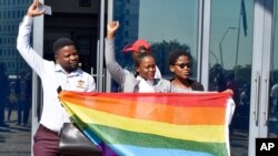 Activists celebrate the High Court's ruling to decriminalize gay sex outside the High Court in Gaborone, Botswana, June 11, 2019.