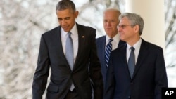 Federal appeals court judge Merrick Garland, walks out with President Barack Obama and Vice President Joe Biden as he is introduced as Obama's nominee for the Supreme Court during an announcement in the Rose Garden of the White House, in Washington, Wednesday, March 16, 2016. (AP Photo/Andrew Harnik)