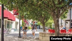 Students walk across the University of Redlands campus in Redlands, California.