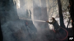 Jesse Katz joins the firefighting effort as a civilian volunteer battling the CZU August Lightning Complex Fire, Aug. 21, 2020, in Bonny Doon, California. 