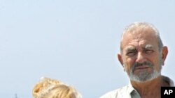 Undated picture released on September 20, 2008, by The French ministry of defence shows, in an unknown location, Jean-Yves Delanne (R) and his wife Bernardette, who were seized by pirates off Somalia.