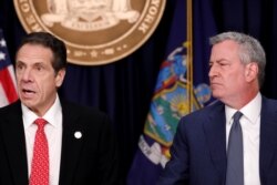 Gubernur New York Andrew Cuomo dan Wali Kota New York City Bill de Blasio dalam konferensi pers mengenai Covid-19, 2 Maret 2020.