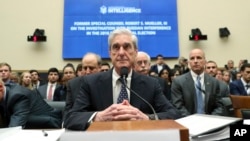 Mantan penasihat khusus Robert Mueller di Gedung Capitol di Washington, D.C., 24 Juli 2019.
