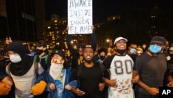 Activists march to the Brooklyn Bridge on May 31, 2020, in New York. 