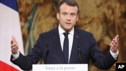 French President Emmanuel Macron delivers his New Year address to the press at the Elysee Palace in Paris, Jan. 3, 2018. 