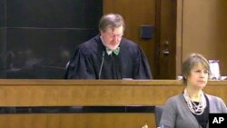 FILE - This March 12, 2013 file still image taken from United States Courts shows Judge James Robart listening to a case at Seattle Courthouse in Seattle. 