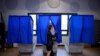 FILE - A voter leaves the booth after casting her ballot in the Pennsylvania primary at a polling place in Philadelphia, Pa., April 26, 2016.