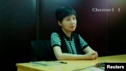 谷开来，2013年8月10日济南中级法院视频截屏。8月23日济南法院在薄熙来审判庭上展示该截屏