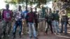 FILE - Anti-balaka fighters stand for a photo in Boda, Central African Republic, Aug. 2014.