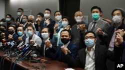 Hong Kong's pro-democracy legislators pose for a photo before a press conference at the Legislative Council in Hong Kong, Nov. 11, 2020.