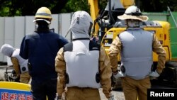 ဂျပန်နိုင်ငံ၊ Kanagawa အရပ်၊ Ayase မြို့ လုပ်ငန်းခွင်တခုတွင်တွေ့ရသည့် အလုပ်သမားများ။ (Aug 19, 2024 REUTERS/Kim Kyung-Hoon)