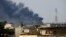 Smoke rises from from the old city during a battle against Islamic State militants, in Mosul, Iraq March, March 24, 2017. 