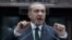 Turkish Prime Minister Recep Tayyip Erdogan addresses parliament in Ankara, Turkey, Tuesday, June 25, 2013 and lashed out at protestors and so-called financial conspirators in Istanbul.