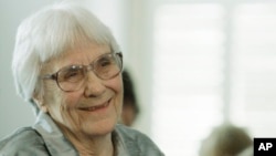FILE - Author Harper Lee smiles during a ceremony in Montgomery, Alabama, Aug. 20, 2007.