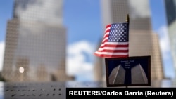 USA, A postcard of the Twin Towers is seen at the 9/11 Memorial ahead of the 20th anniversary of the September 11 attacks in Manhattan, New York City, U.S., September 10, 2021. 