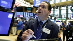 Trader Tommy Kalikas works on the floor of the New York Stock Exchange, May 7, 2018.
