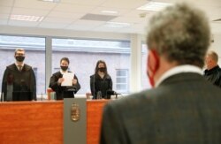 Andras Arato, president of Klubradio, listens as Judge Regina Antal delivers the verdict on the fate of the broadcaster whose license was not automatically renewed by the media authority last year in Budapest, Hungary, Feb. 9, 2021.