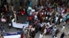 Pakistani Christians block a main highway during a rally to condemn a suicide bombing on a church, in Islamabad, Pakistan, Sept. 23, 2013. 