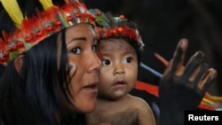 Members of an indigenous group from the Amazon region attend a meeting with Pope Francis at the Coliseo Regional Madre de Dios in Puerto Maldonado, Peru, Jan. 19, 2018. 