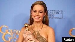Brie Larson poses with the award for Best Performance by an Actress in a Motion Picture - Drama for her role in "Room" during the 73rd Golden Globe Awards in Beverly Hills, Calif., Jan. 10, 2016.