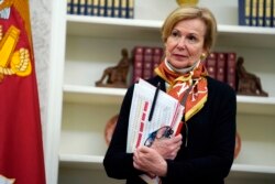 FILE - White House coronavirus response coordinator Dr. Deborah Birx listens during an event in honor of World Nurses Day in the Oval Office of the White House, May 6, 2020, in Washington.