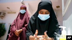 Somali female wash their hands during coronavirus awareness training conducted by the local paramedics and doctors in Somali capital Mogadishu, March, 19, 2020. 