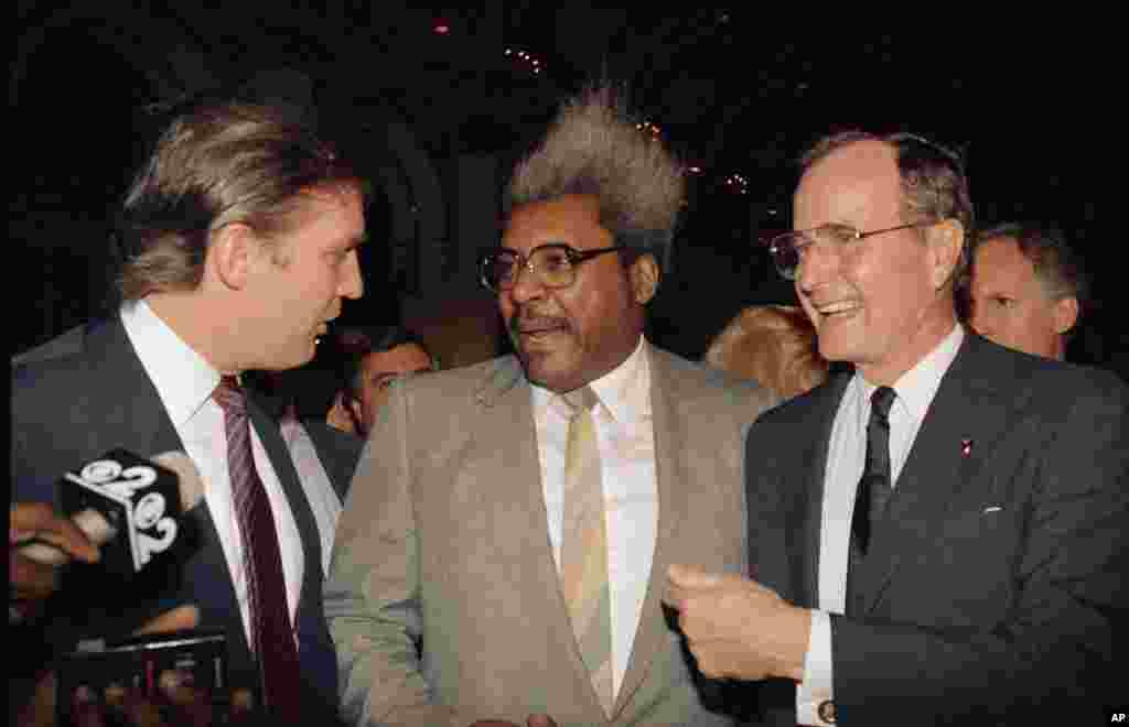 Vice President George Bush, right, shares a light moment with, from left, real estate developer and casino owner Donald Trump and fight promoter Don King, April 12, 1988 at New York's Plaza Hotel during a fundraiser for Bush by Trump. (AP Photo/David Book