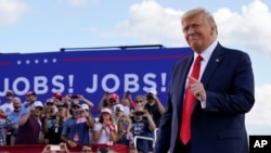 President Donald Trump arrives to speak at a campaign rally at Wittman Airport in Oshkosh, Wis., Aug. 17, 2020.