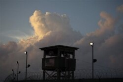 FILE - A guard tower in front of the detention facility on Guantanamo Bay US Naval Base in Cuba in 2019.