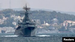 The Russian Navy's frigate Pytlivy, followed by landing ship Nikolai Filchenkov, sails in the Bosphorus, on its way to the Mediterranean Sea, in Istanbul, Turkey, Aug. 24, 2018. 