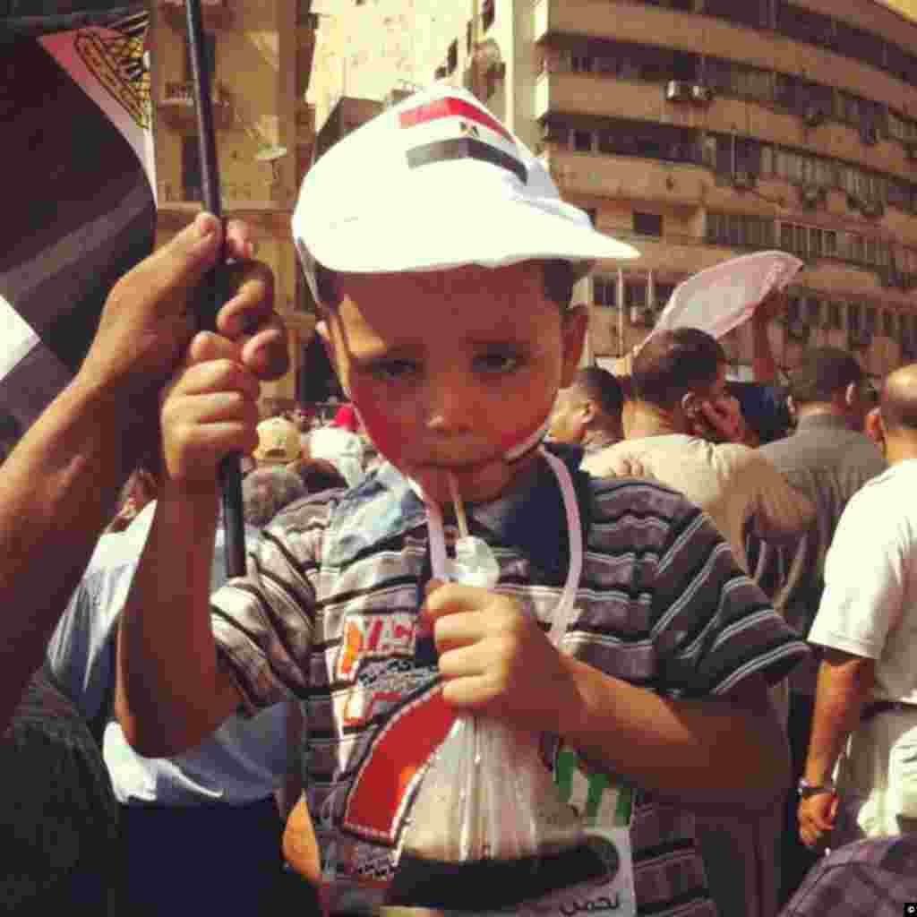 A child stands in the middle of a June 18th, 2012 protest in Tahrir Square of Cairo.
