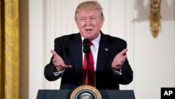 President Donald Trump speaks at a women's empowerment panel in the East Room of the White House in Washington, March 29, 2017.