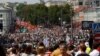 Participants march with flags and placards during an anti-government protest in Moscow 