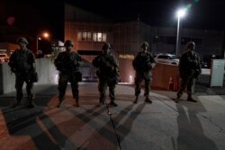 The National Guard protect the perimeter of government buildings in Kenosha, Wis. on Aug. 27, 2020.