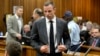 Olympic and Paralympic track star Oscar Pistorius arrives in court ahead of his trial at the North Gauteng High Court in Pretoria, March 3, 2014.