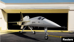 Boom Supersonic’s demonstrator aircraft XB-1 is seen parked at a hangar in Denver, Colorado in an undated photograph released on October 7, 2020. (Boom Supersonic/Nathan Leach-Proffer/Handout via Reuters)