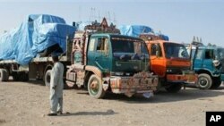 Afghanistan-bound NATO trucks are parked at a roadside as authorities blocked NATO supply line to Afghanistan after NATO allegedly killed three border guards at Pakistani border, at tribal check post of Takhta Beg in Khyber area of Pakistan near Pak-Afgha