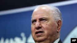 Ahmed Chalabi speaks to the media in Baghdad, Tuesday, July 15, 2014.