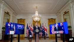 President Joe Biden, joined virtually by Australian Prime Minister Scott Morrison and British Prime Minister Boris Johnson, speaks about a national security initiative from the East Room of the White House in Washington, Wednesday, Sept. 15, 2021. (AP Photo/Andrew Harnik)