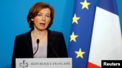 FILE - French Minister of the Armed Forces Florence Parly makes an official statement in the press room at the Elysee Palace, in Paris, April 14, 2018. 