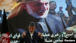  Afghan President Hamid Karzai speaks during a joint news conference with NATO Secretary General Anders Fogh Rasmussen following a security handover ceremony at a military academy outside Kabul, Afghanistan, June 18, 2013.