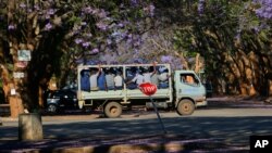 A truck carrying police officers on a street in Harare, Oct, 19, 2020.