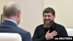 FILE - Head of the Chechen Republic Ramzan Kadyrov speaks during a meeting with Russia's President Vladimir Putin at a residence near Moscow, Aug. 31, 2019. (Sputnik/Alexei Nikolsky/Kremlin via Reuters) 