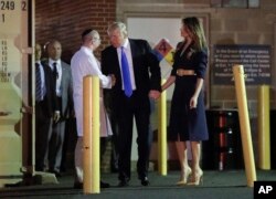 President Donald Trump and first lady Melania Trump talk with Dr. Ira Y. Rabin, left, after visiting MedStar Washington Hospital Center in Washington, June 14, 2017, where House Majority Leader Steve Scalise of La. was taken after being shot in Alexandria
