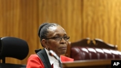FILE - Presiding Judge Thokozile Masipa listens to arguments at the end of the fourth day of sentencing proceedings for Oscar Pistroius in the high court in Pretoria, South Africa, Oct. 16, 2014.