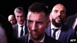 Inter Miami CF's Argentine forward Lionel Messi (C) reacts as he leaves the 2023 Ballon d'Or France Football award ceremony at the Theatre du Chatelet in Paris on October 30, 2023.