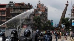 Nepalese protesters defying a government coronavirus lockdown to take part in a religious festival clash with riot police, in Lalitpur, Nepal, Thursday, Sept. 3, 2020.