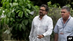 Ivan Marquez, chief negotiator for the Revolutionary Armed Forces of Colombia (FARC), center, arrives for a news conference at the close of the 19th round of peace talks with Colombia's government in Havana, Cuba, Feb. 1