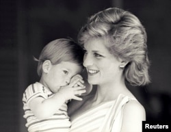 FILE PHOTO - Britain's Princess Diana holds Prince Harry while on holiday as guests of King Juan Carlos and Queen Sofia in Spain August 1988.